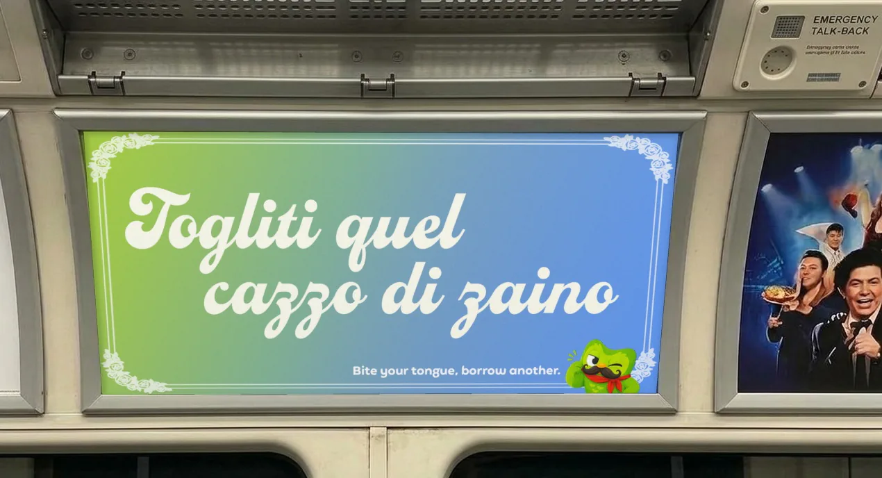 Duolingo poster on the Tube: Take your fucking backpack off, in Italian
